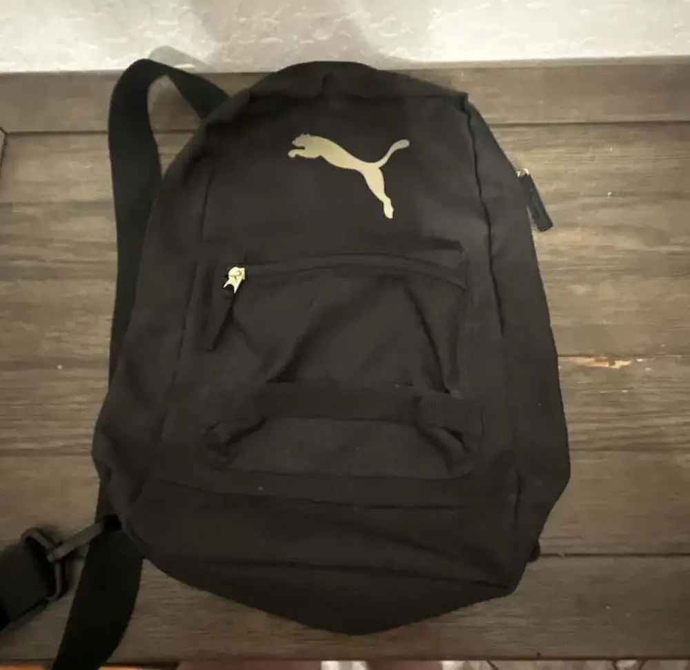 Puma Black Sling Backpack with Gold Logo